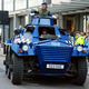 Illustration for article titled Vigilante Hippie Six-Wheeled Riot Tank Tries To Battle G20 Summit Protesters